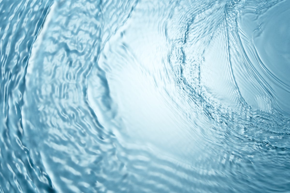 Background of blue clear water in motion with waves