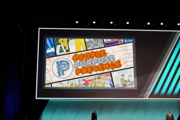 A video with the words "People Purpose Presence" on the screen at the APWA PWX Conference.