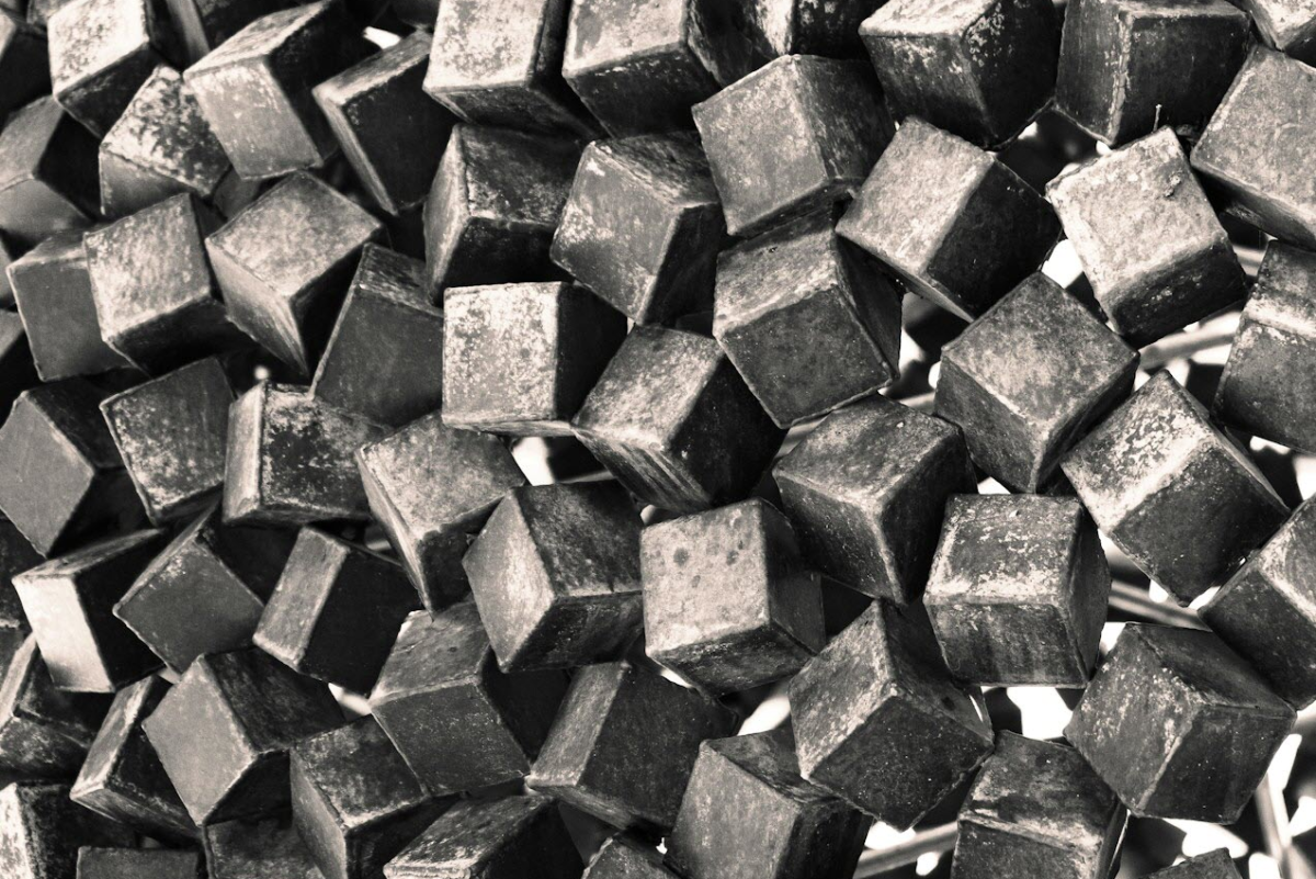 Close-up of numerous small tungsten carbide cubes.