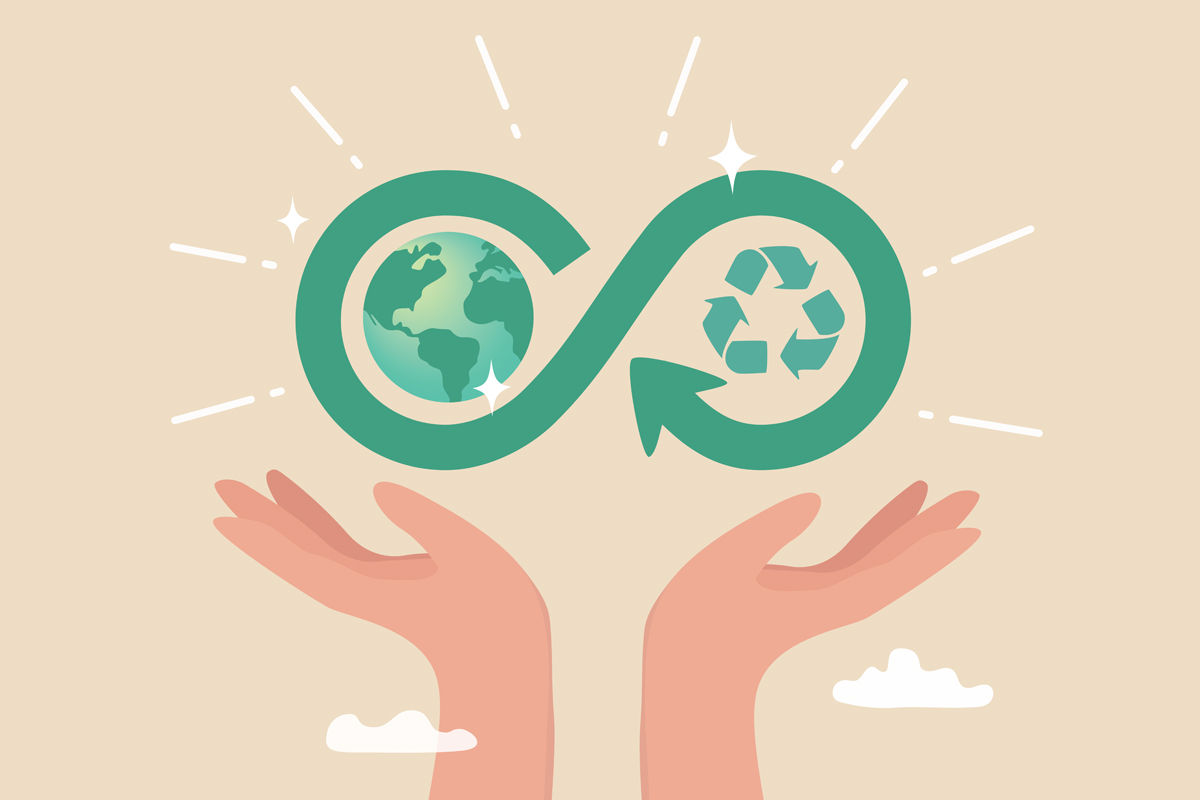 Two hands hold up an infinity symbol featuring a globe and a recycling icon, representing the circular economy.