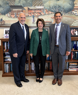 a photo of APWA CEO Scott Grayson and APWA President Dominick Longobardi with Minnesota Democratic US Senator Amy Klobuchar