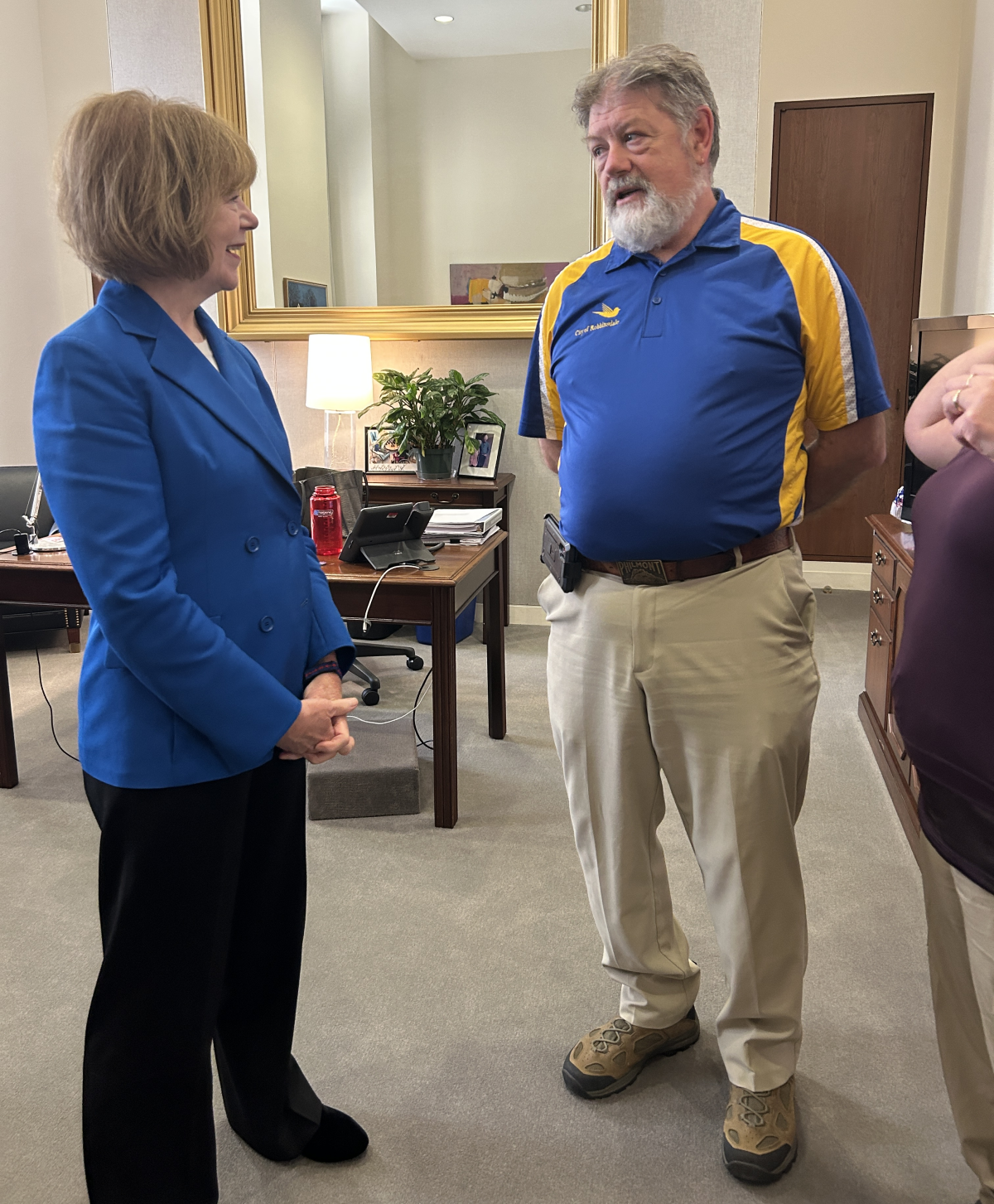a photo of APWA Project of the Year Winner Richard McCoy meeting with Senator Tina Smith (D-Minnesota)