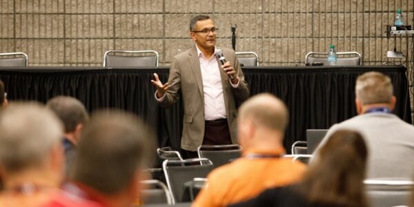 a photo of a speaker addressing the audience at PWX