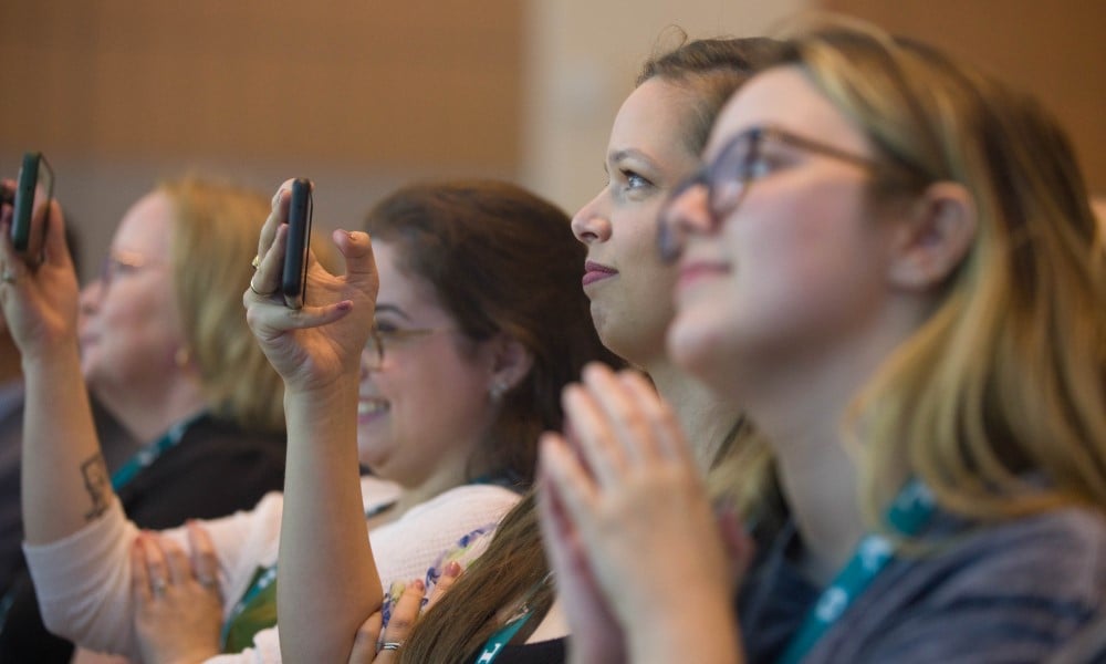 Attendees at PWX 2023 take in a general session
