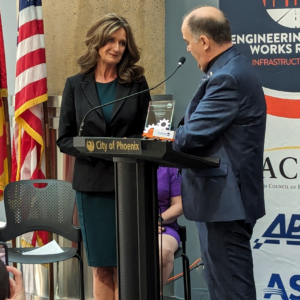 APWA President Gary Losier presents a crystal to Phoenix City Councilwoman Ann O'Brien