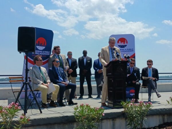 a speaker addresses the crowd at an event at the Low Battery Seawall Restoration Project in Charleston, South Carolina