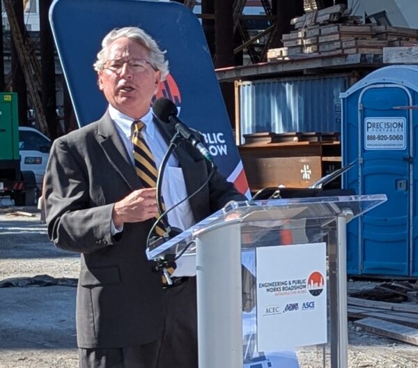 a photo of APWA Region IV Director Robert Garland speaking at the Engineering & Public Works Roadshow event showcasing Miami’s Signature Bridge