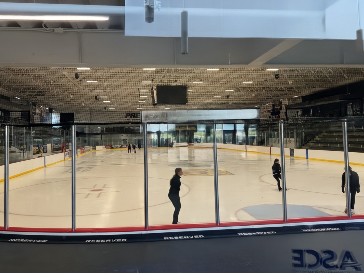 Skaters practicing on the ice at the Prairie Lakes Ice Arena.