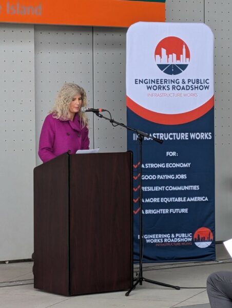 a photo of a speaker addressing the crowd at the Engineering and Public Works Roadshow event at the Colman Dock in Seattle