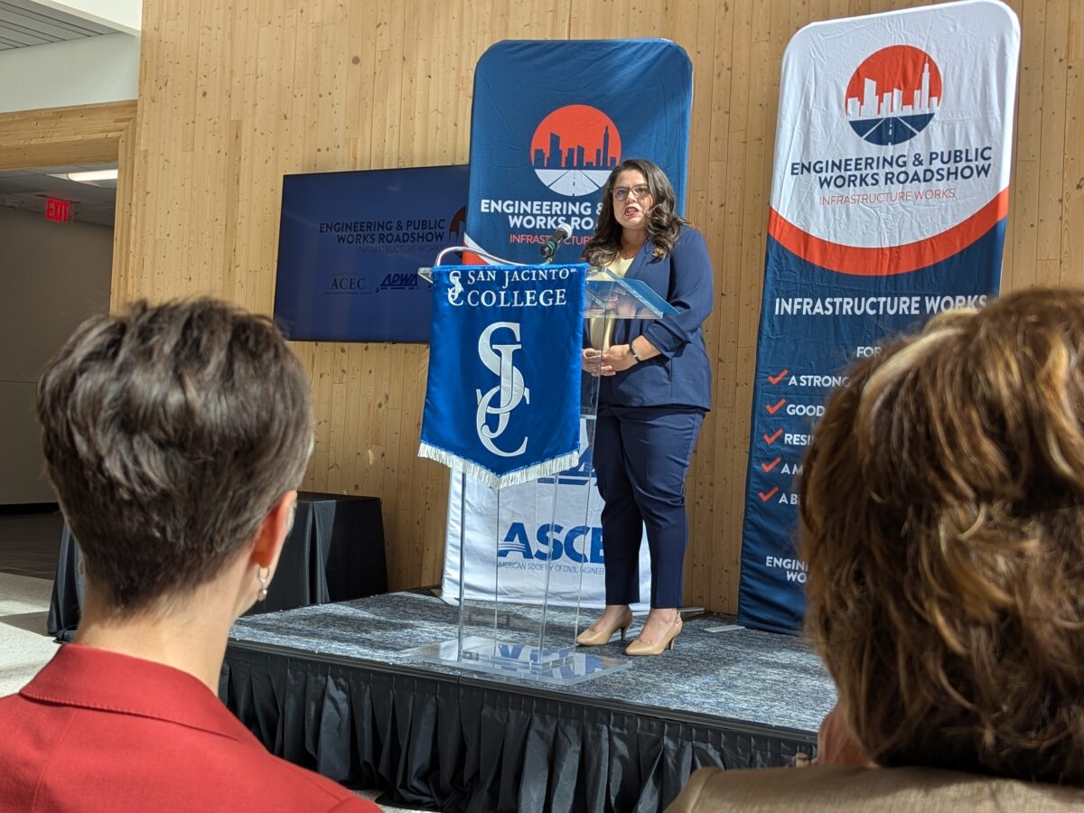 a photo of Kristina Ramirez, P.E., CPM, CFM, speaking at an Engineering and Public Works Roadshow stopped at San Jacinto College