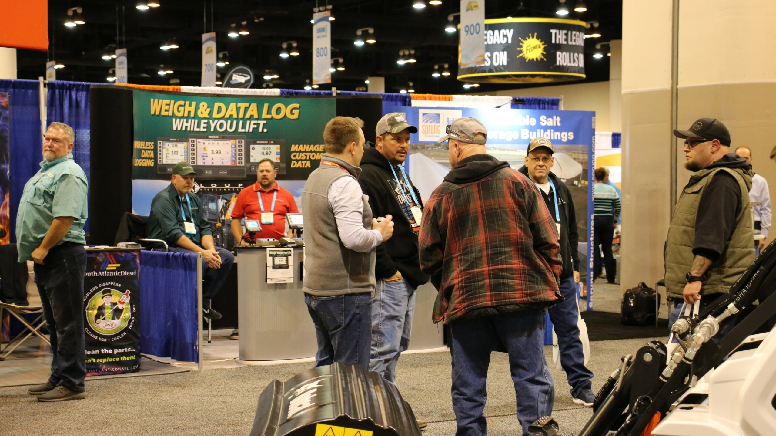 a photo of attendees chatting on the Snow Conference exhibit floor