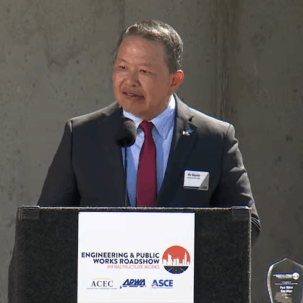 Man speaking at podium during Roadshow stop in San Diego.