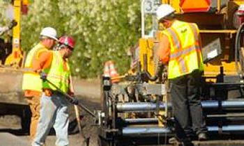 public works professionals working on a road