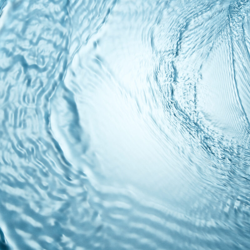 Background of blue clear water in motion with waves