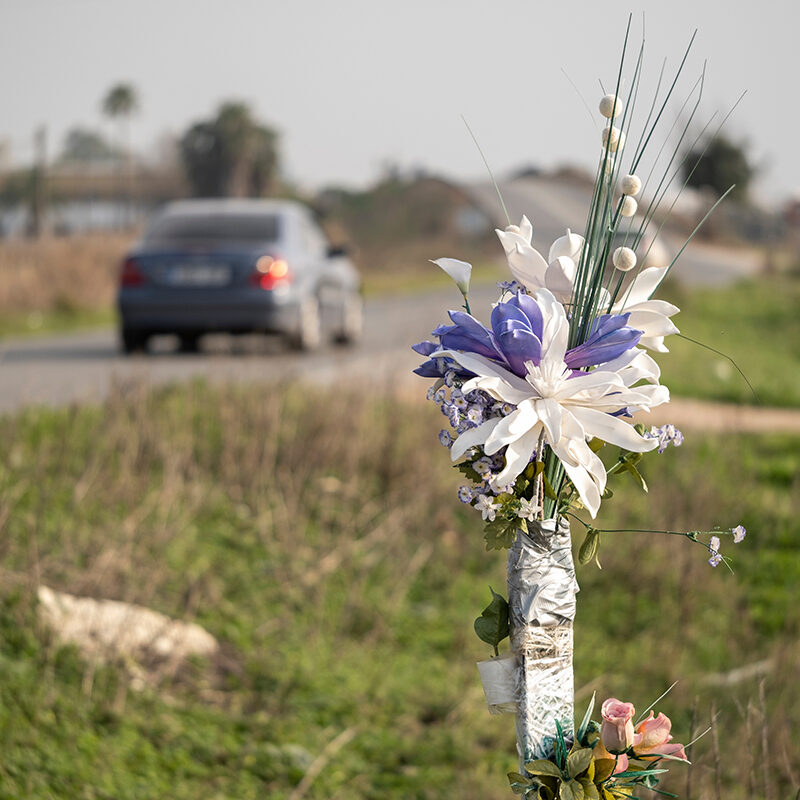 Flowers placed roadside in memorial.