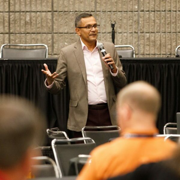 a photo of a speaker addressing the audience at PWX