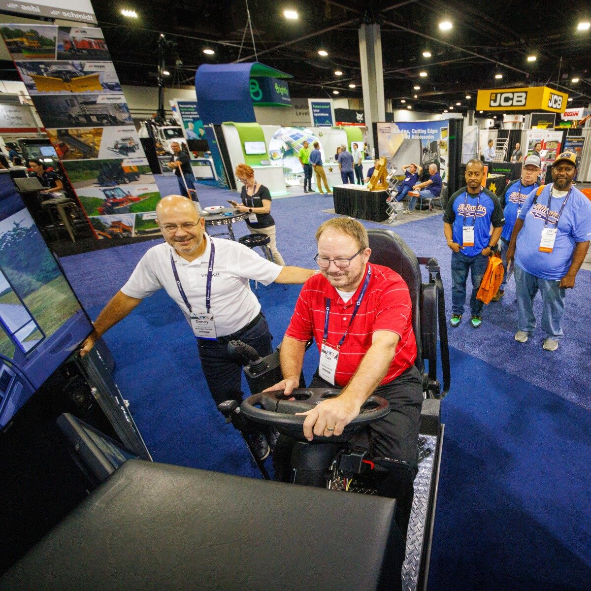 PWX exhibit hall simulator a PWX attendee tries out a driving simulator on the exhibit floor
