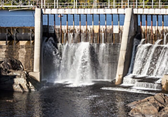 Water spilling through a dam