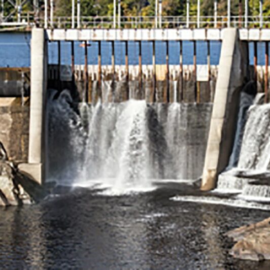 Water spilling through a dam