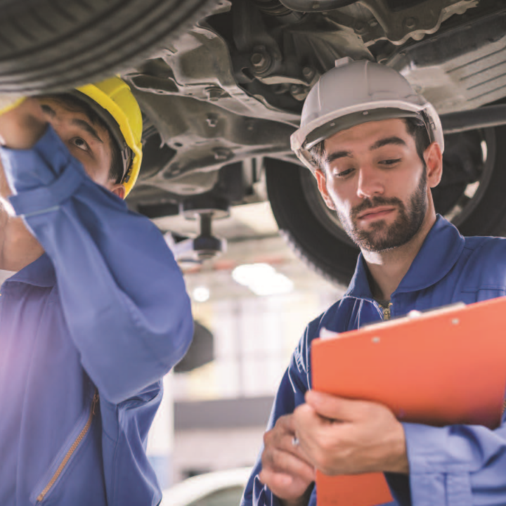 a photo of men working on a vehicle
