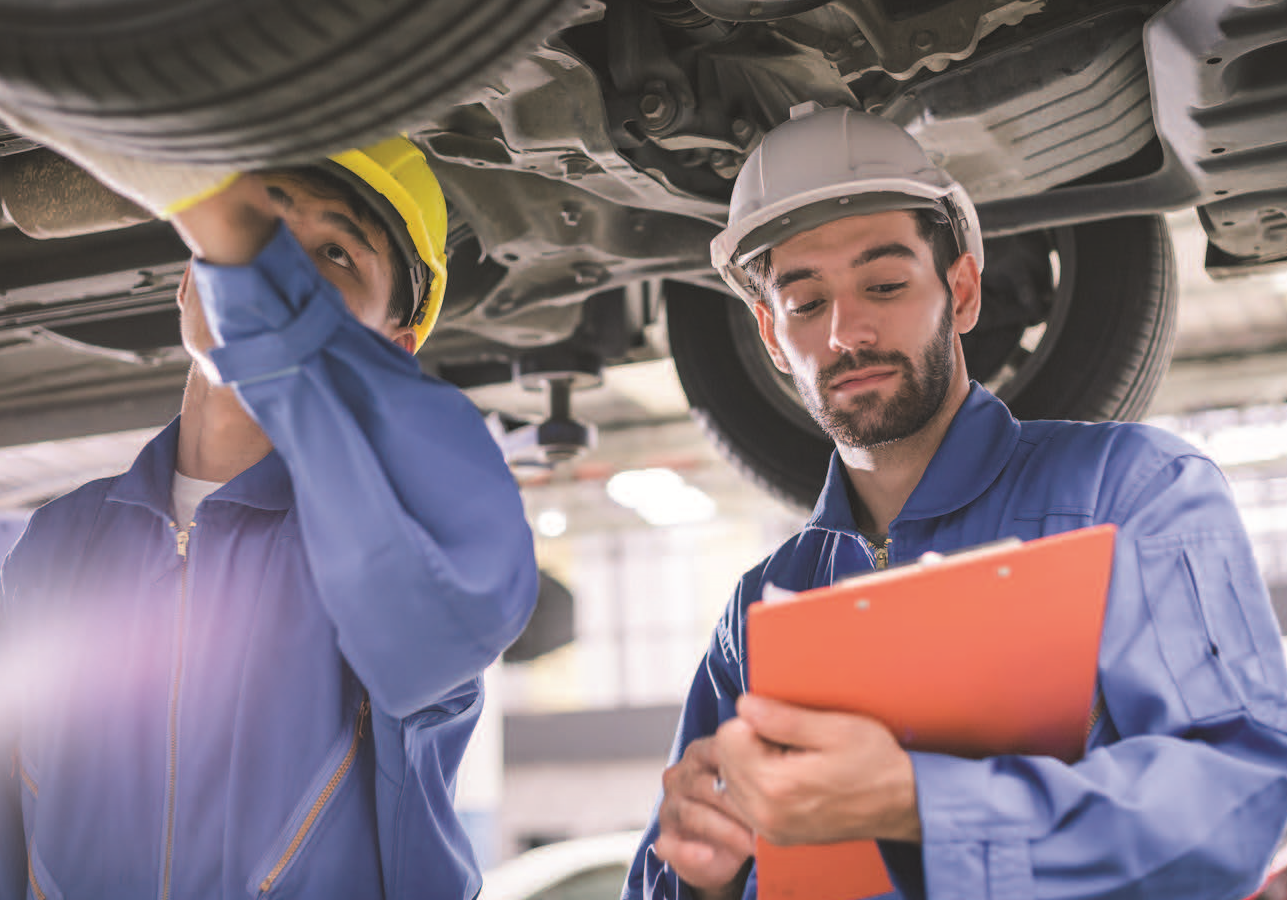 a photo of men working on a vehicle