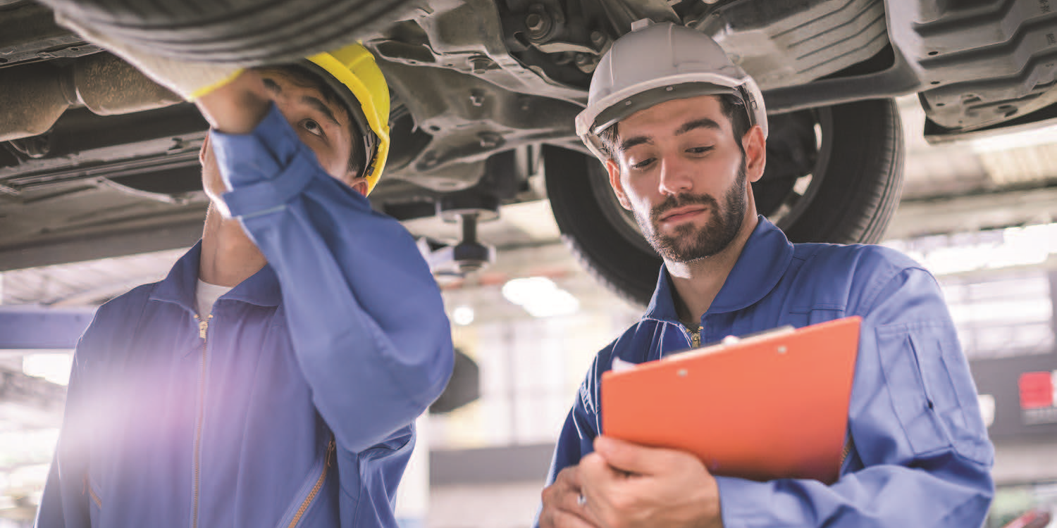 a photo of men working on a vehicle