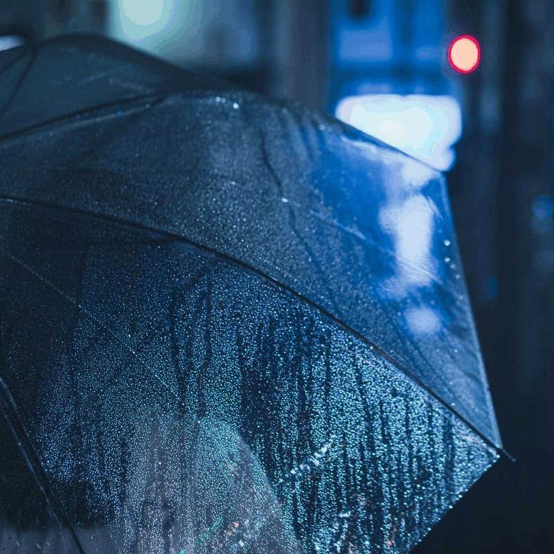 Raindrops on an umbrella.