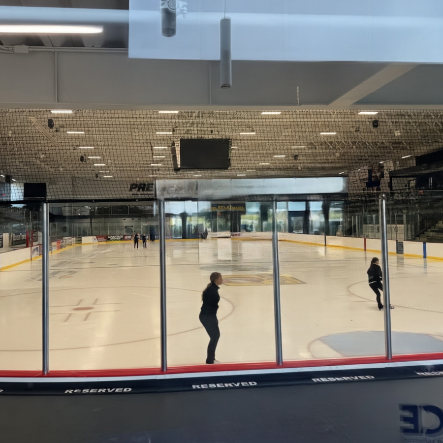 Skaters practicing on the ice at the Prairie Lakes Ice Arena.