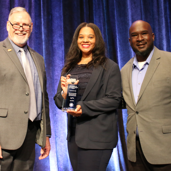 APWA president presents an award to winners