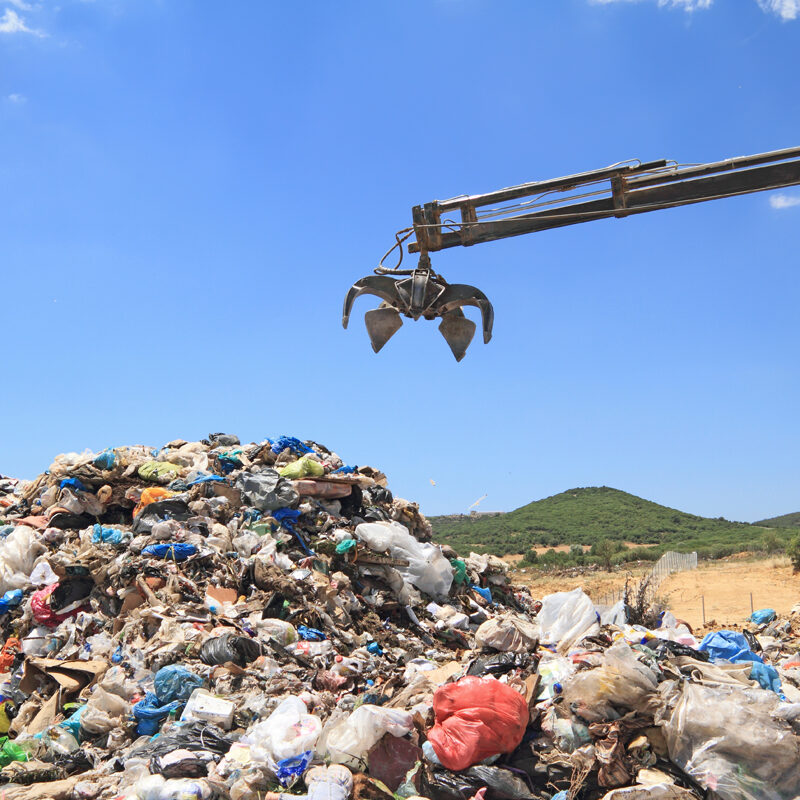 Grabber crane working in landfill