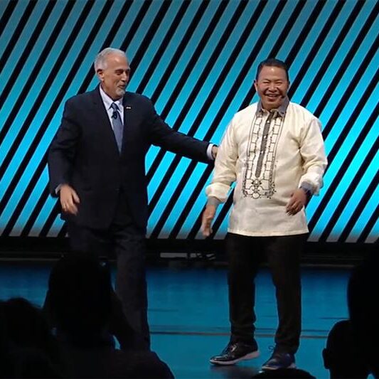 APWA President Vic Bianes on stage with APWA Past President Dominick Longobardi