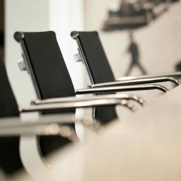 empty chairs at a boardroom table