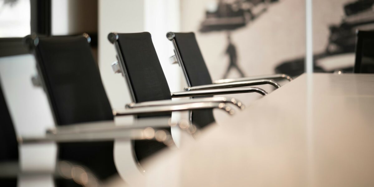 empty chairs at a boardroom table