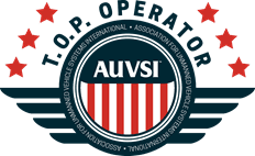 Logo of Top Operator Auvsi. The logo has 6 red stars in the top and also blue aviation lines at the right and left ends. 